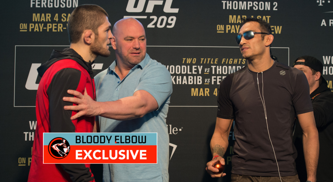 Khabib Nurmagomedov squaring off with Tony Ferguson as Dana White stands between them
