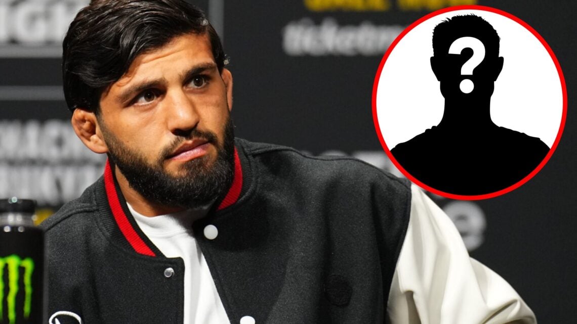 Arman Tsarukyan on stage at the UFC 311 press conference, inset mystery icon