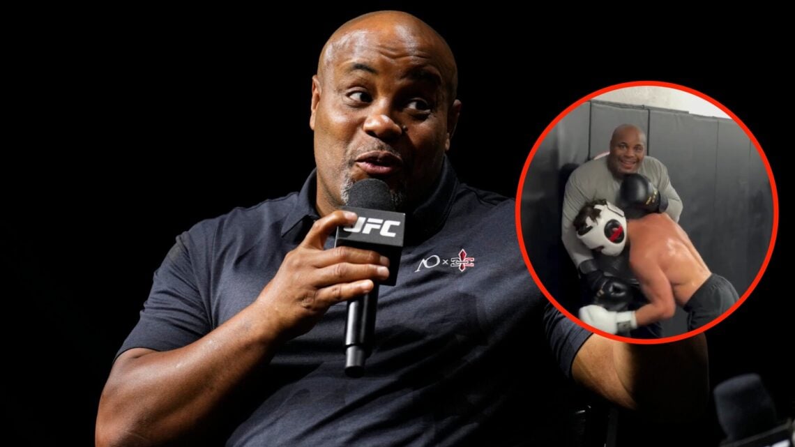 Center: Daniel Cormier attends a fan Q&A event at the Smoothie King Center in New Orleans, Louisiana ahead of UFC 318. Insert: Daniel Cormier smile...