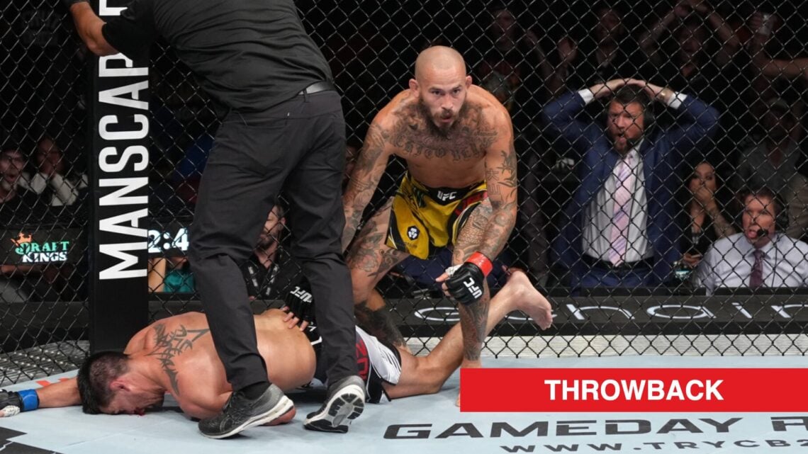 Marlon Vera stands over Dominick Cruz after knocking him out with a head kick in their fight at UFC San Diego
