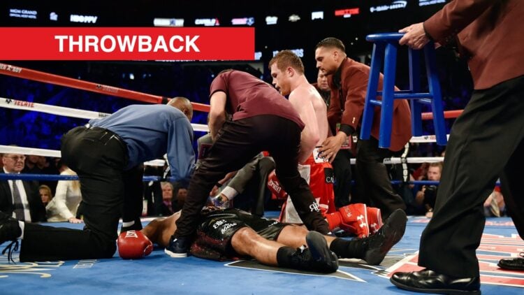 Canelo Alvarez kneels over Amir Khan after knocking him out.