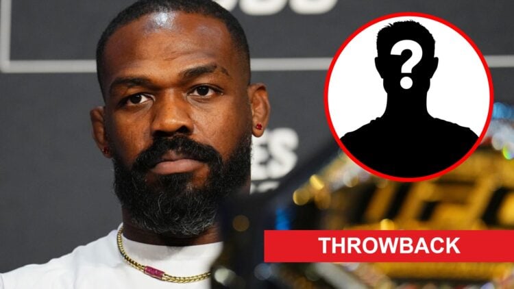 Jon Jones on stage at the UFC 309 press conference, inset mystery icon and throwback banner
