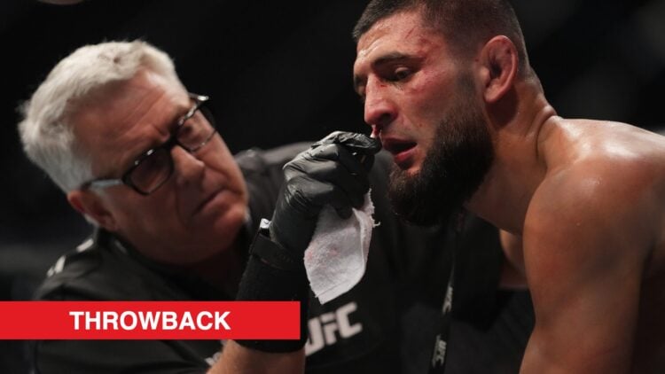 Khamzat Chimaev is tended to by a cutman in the corner during his fight against Gilbert Burns at UFC 273