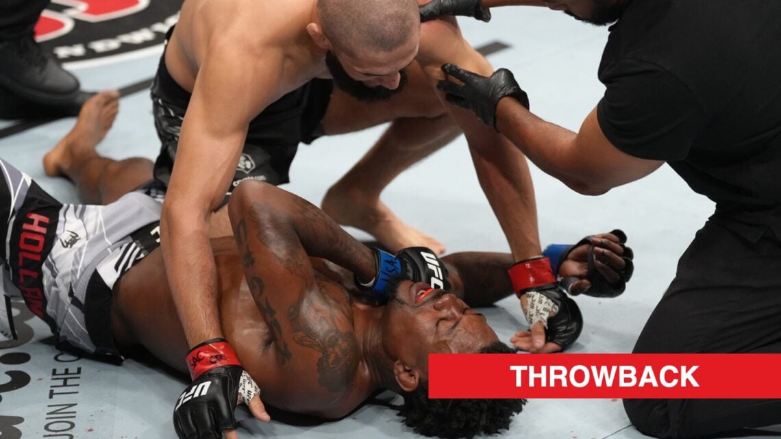 Khamzat Chimaev interacts with Kevin Holland after submitting him in their fight at UFC 279