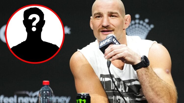 Sean Strickland speaks on stage at the UFC 312 press conference, inset mystery icon
