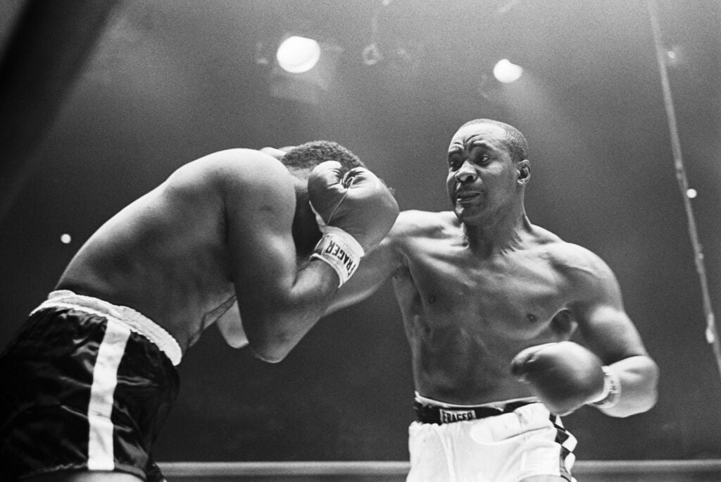 Sonny Liston punches Floyd Patterson in their rematch