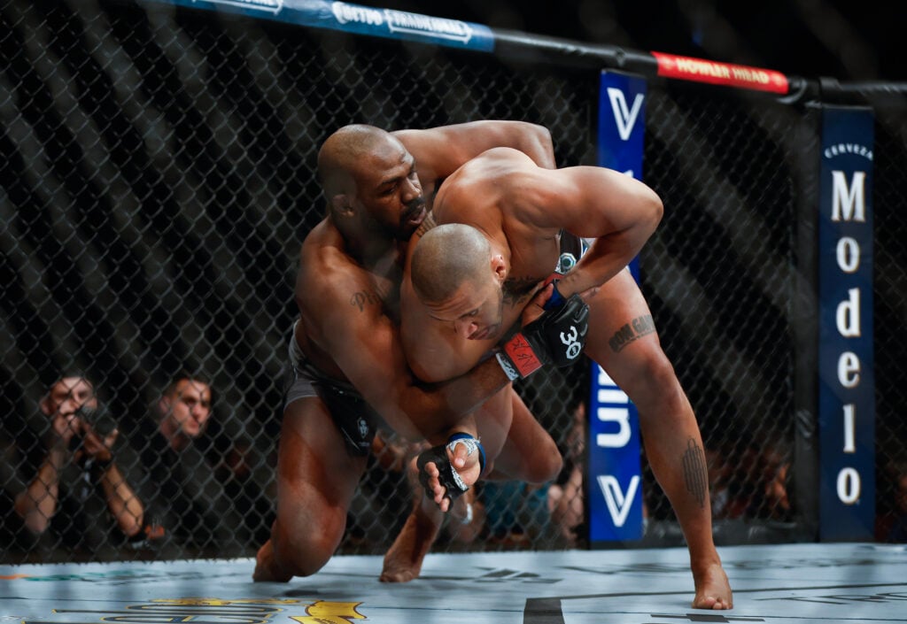Ciryl Gane grapples with Jon Jones at UFC 285