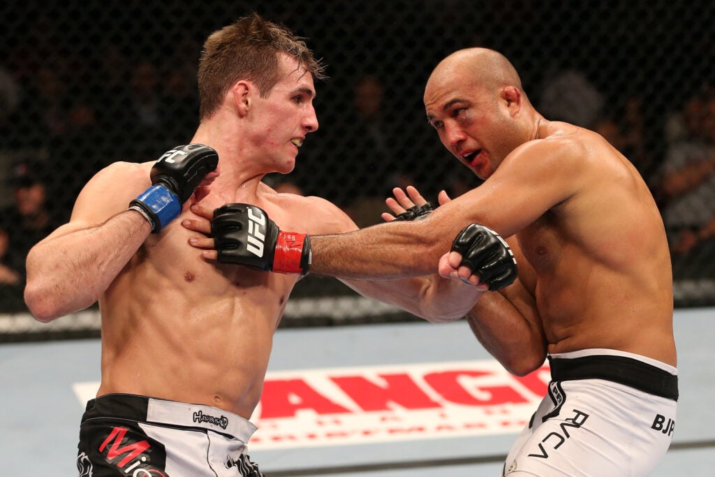 Rory MacDonald punches BJ Penn during UFC on FOX bout