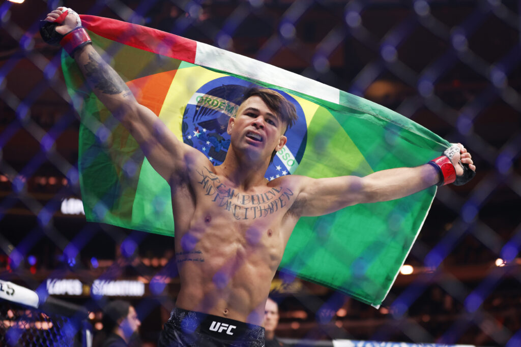 Diego Lopes holding both Brazilian and Mexican flags at UFC 295
