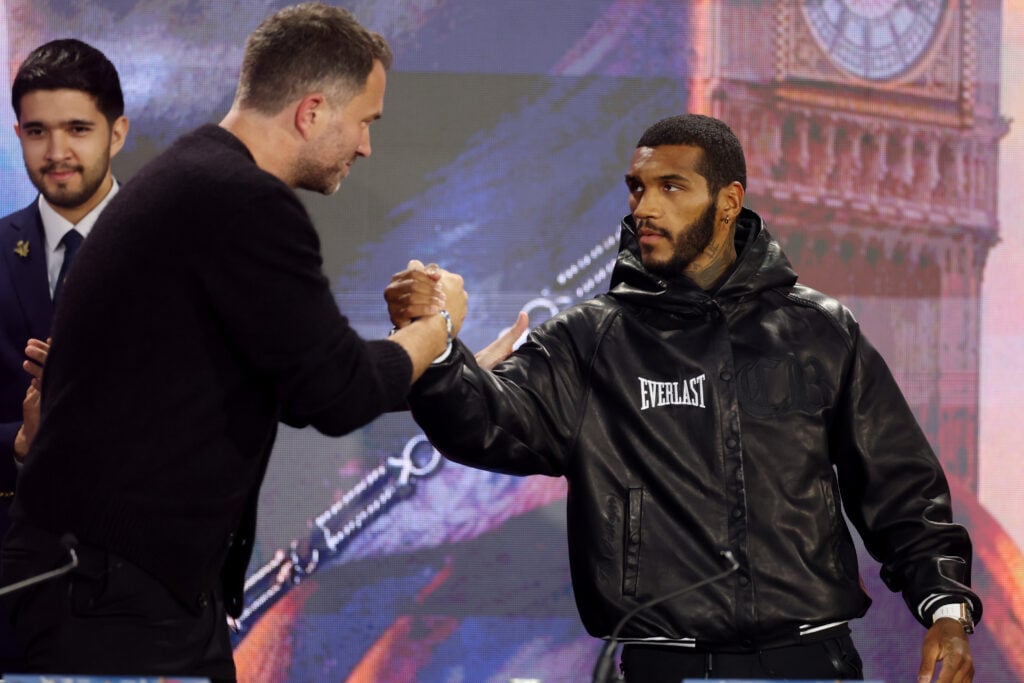 Eddie Hearn and Conor Benn shake hands at a press conference