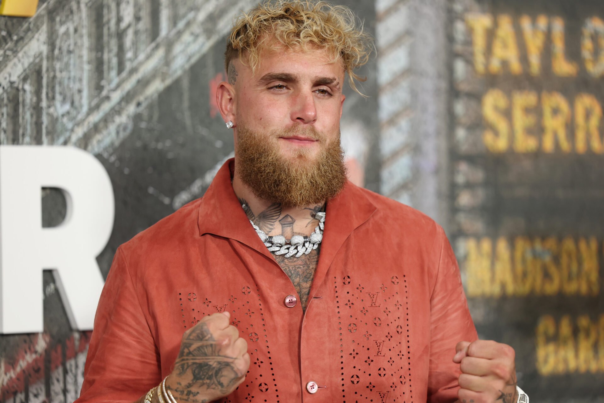 Jake Paul poses for pictures at the Katie Taylor vs Amanda Serrano 3 fight