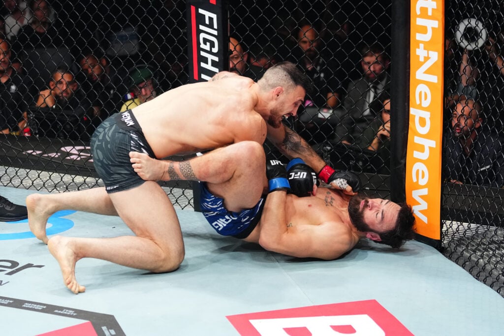 Modestas Bukauskas lands left hand on Paul Craig during UFC Paris