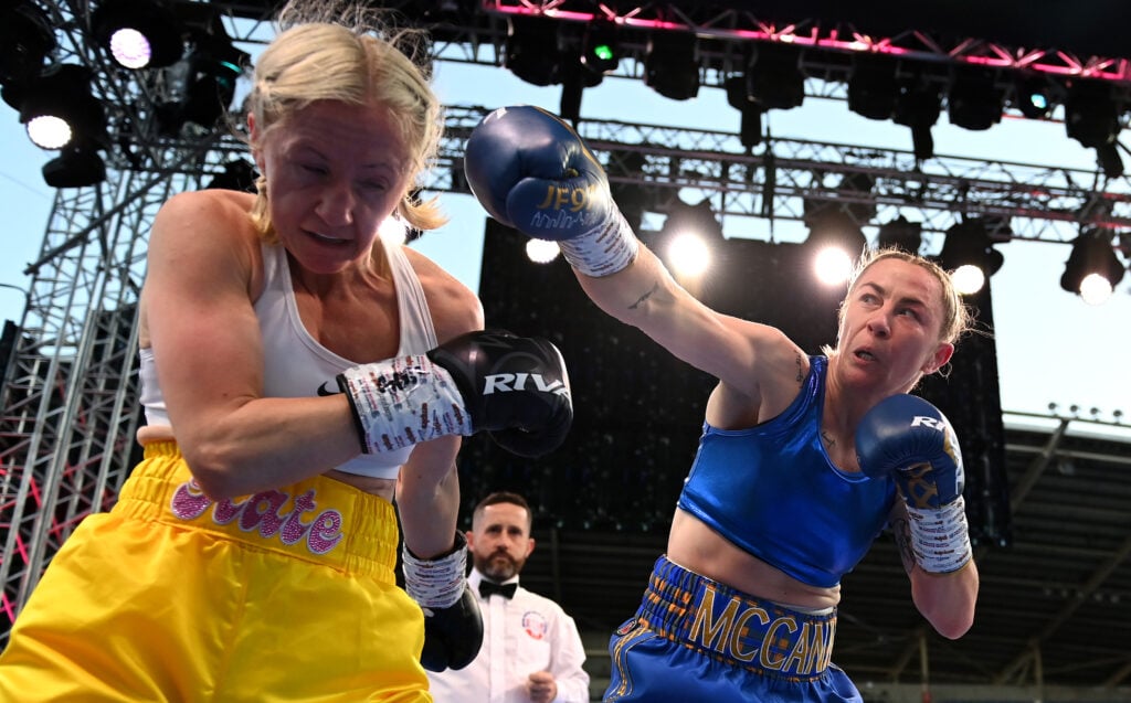 Molly McCann throws a punch at Kate Radomska during their bantamweight fight at Windsor Park in Belfast, Northern Ireland.
