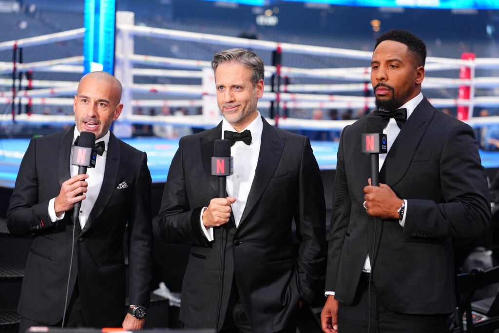 Commentators Jon Anik, Max Kellerman, and Andre Ward are seen during a super middleweight bout on the undercard of the Canelo v Crawford event at Allegiant Stadium on September 13, 2025 in Las Vegas, Nevada.