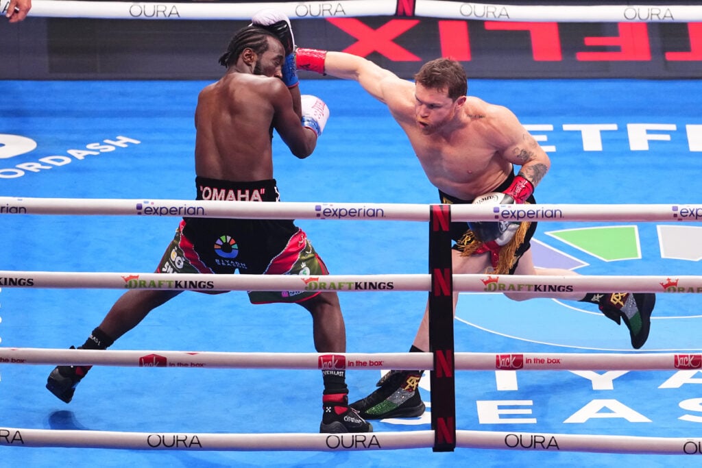 Canelo Alvarez lands a punch on Terence Crawford in their fight