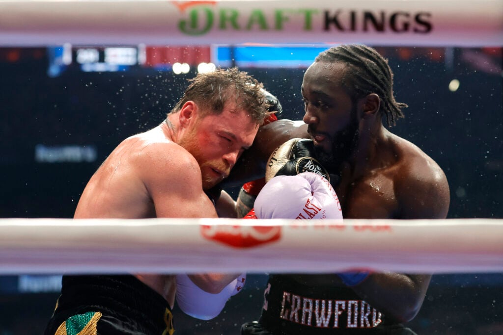 Canelo Alvarez and Terence Crawford exchange punches during their super middleweight title fight