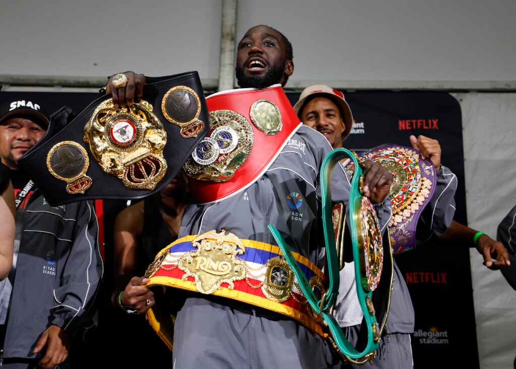 Terence Crawford poses with his undisputed super middleweight titles
