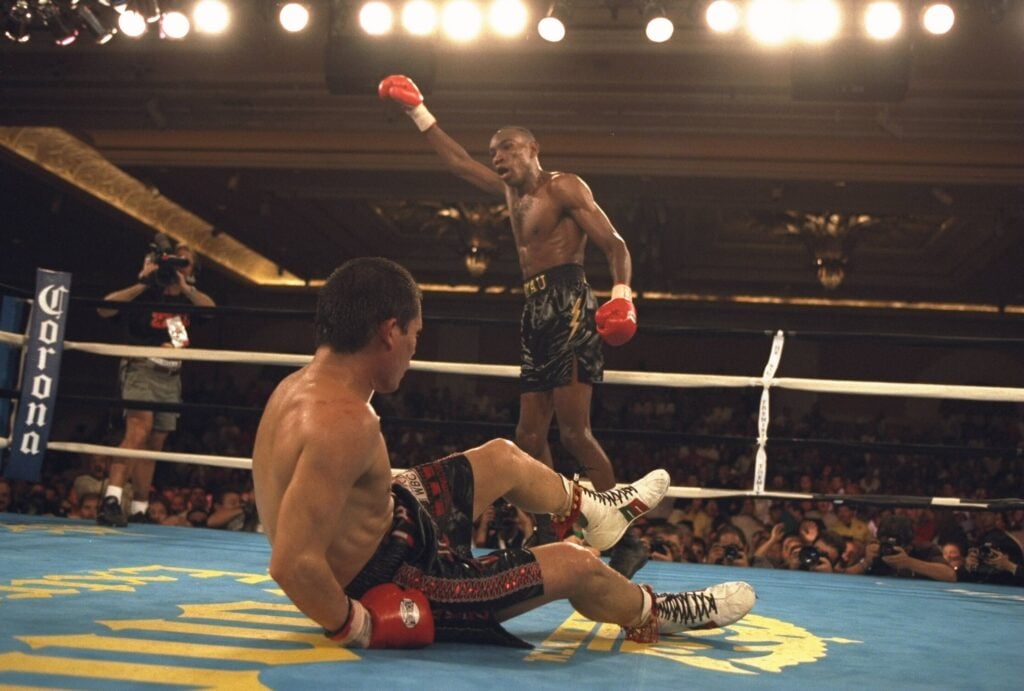 David Kamau celebrates after knocking down Julio Cesar Chavez