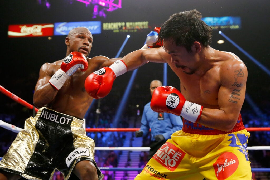 Floyd Mayweather and Manny Pacquiao trade punches