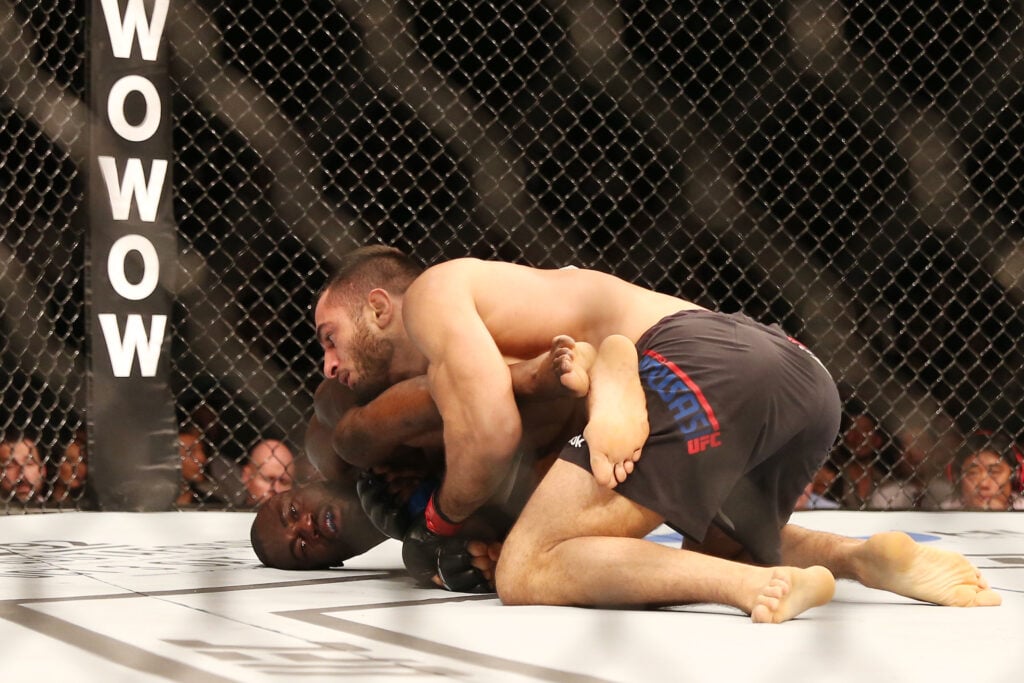Gegard Mousasi controls Uriah Hall on the ground during their fight at UFC Saitama