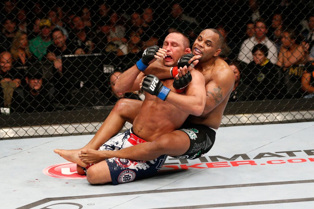 Daniel Cormier attempts to submit Dan Henderson