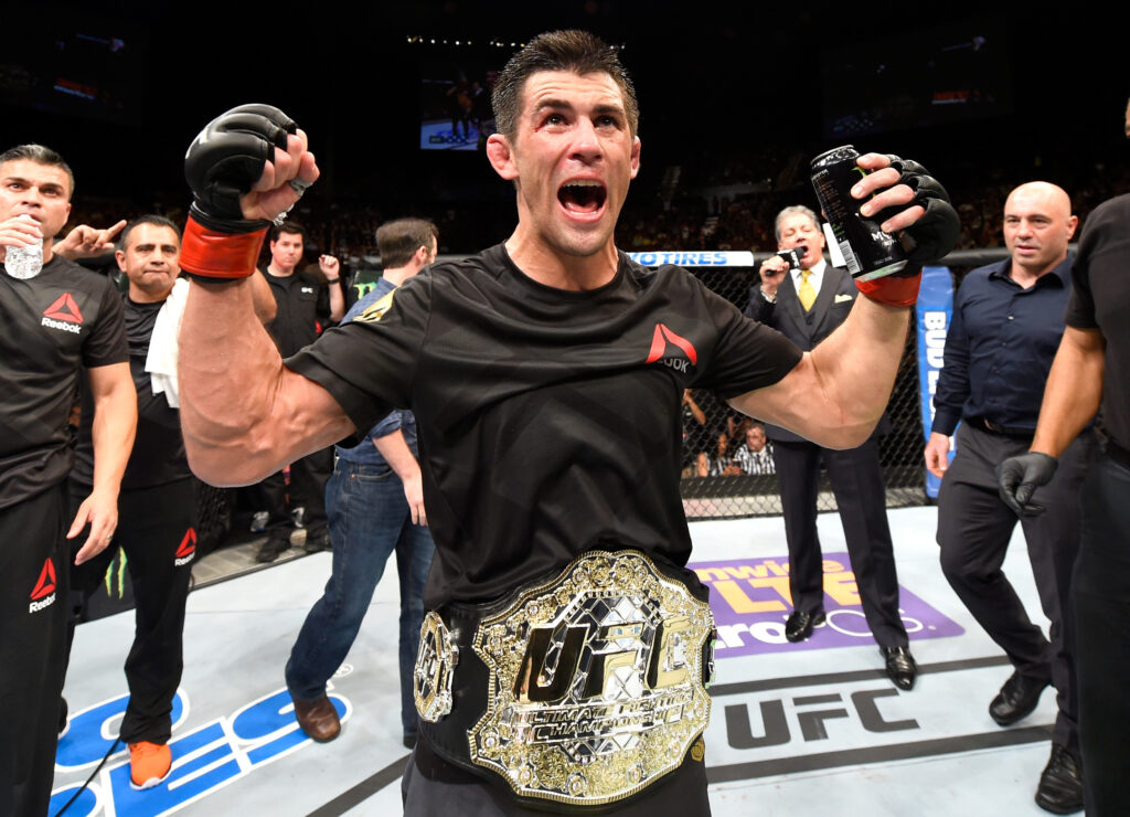 Dominick Cruz celebrating UFC 199 title win