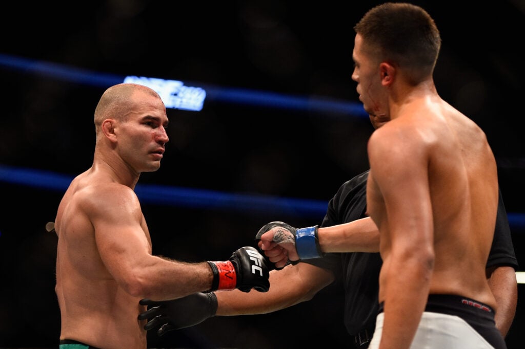 Artem Lobov and Chris Avila touch gloves at the end of their UFC 202 fight