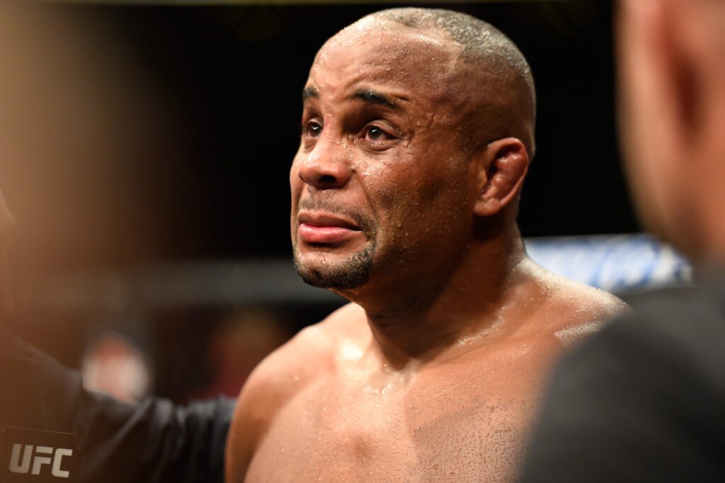 Daniel Cormier speaks with Joe Rogan in the Octagon after his light heavyweight title fight loss to Jon Jones in July, 2017.