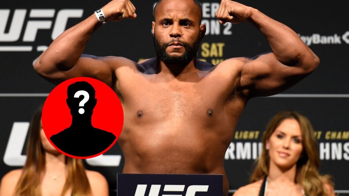 Daniel Cormier flexes at the UFC 210 weigh-ins, with mystery inset