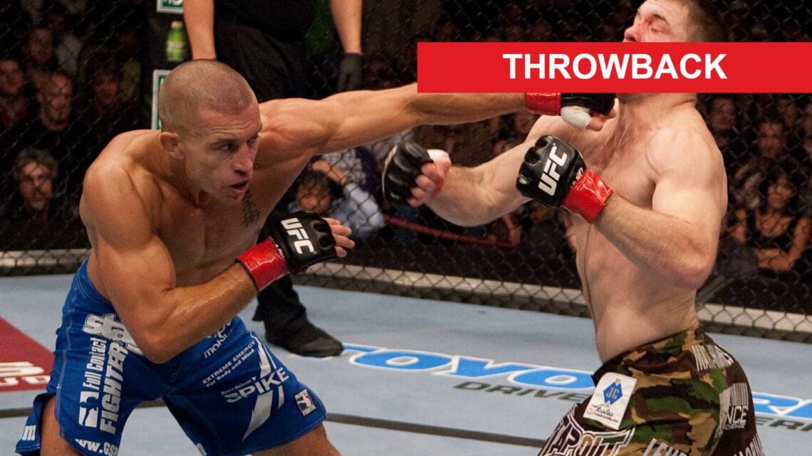 Georges St Pierre punches Matt Hughes at UFC 65