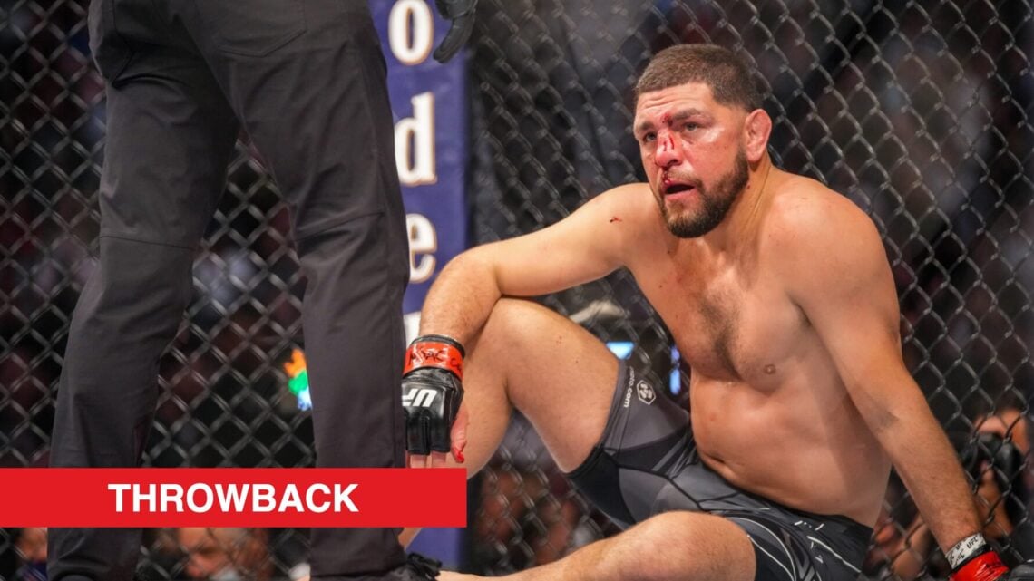 Nick Diaz reacts after getting knocked down by Robbie Lawler in their fight at UFC 266