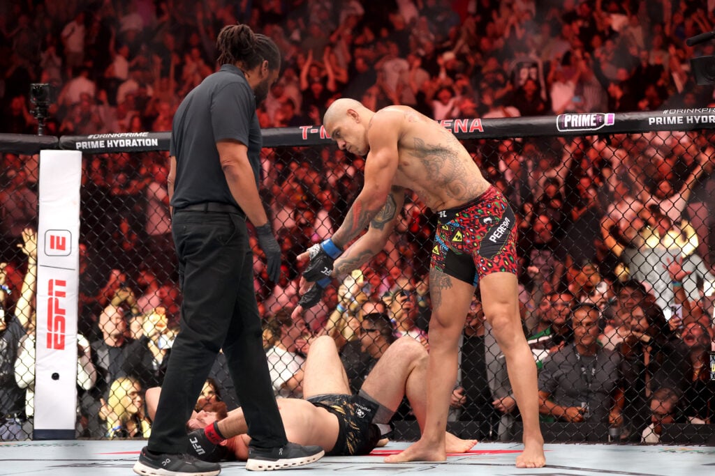 Alex Pereira celebrates immediately after his UFC 320 win over Magomed Ankalaev