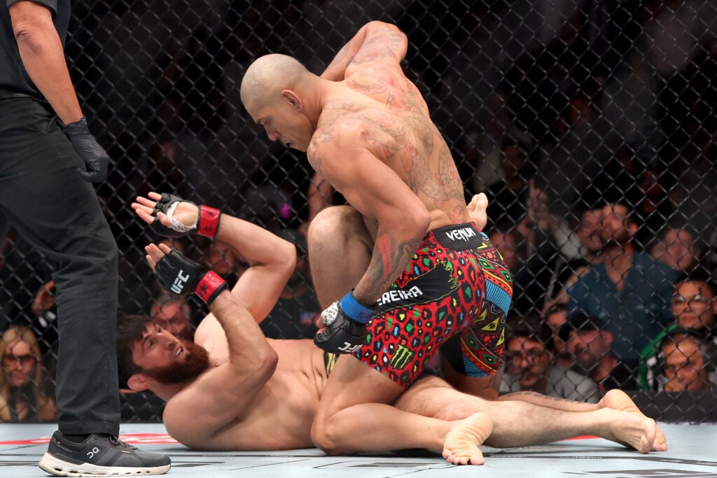 Alex Pereira lines up a punch after flooring Magomed Ankalaev at UFC 320