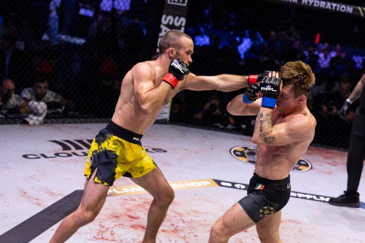 Jack Cartwright punches Caolan Loughran in their PFL fight