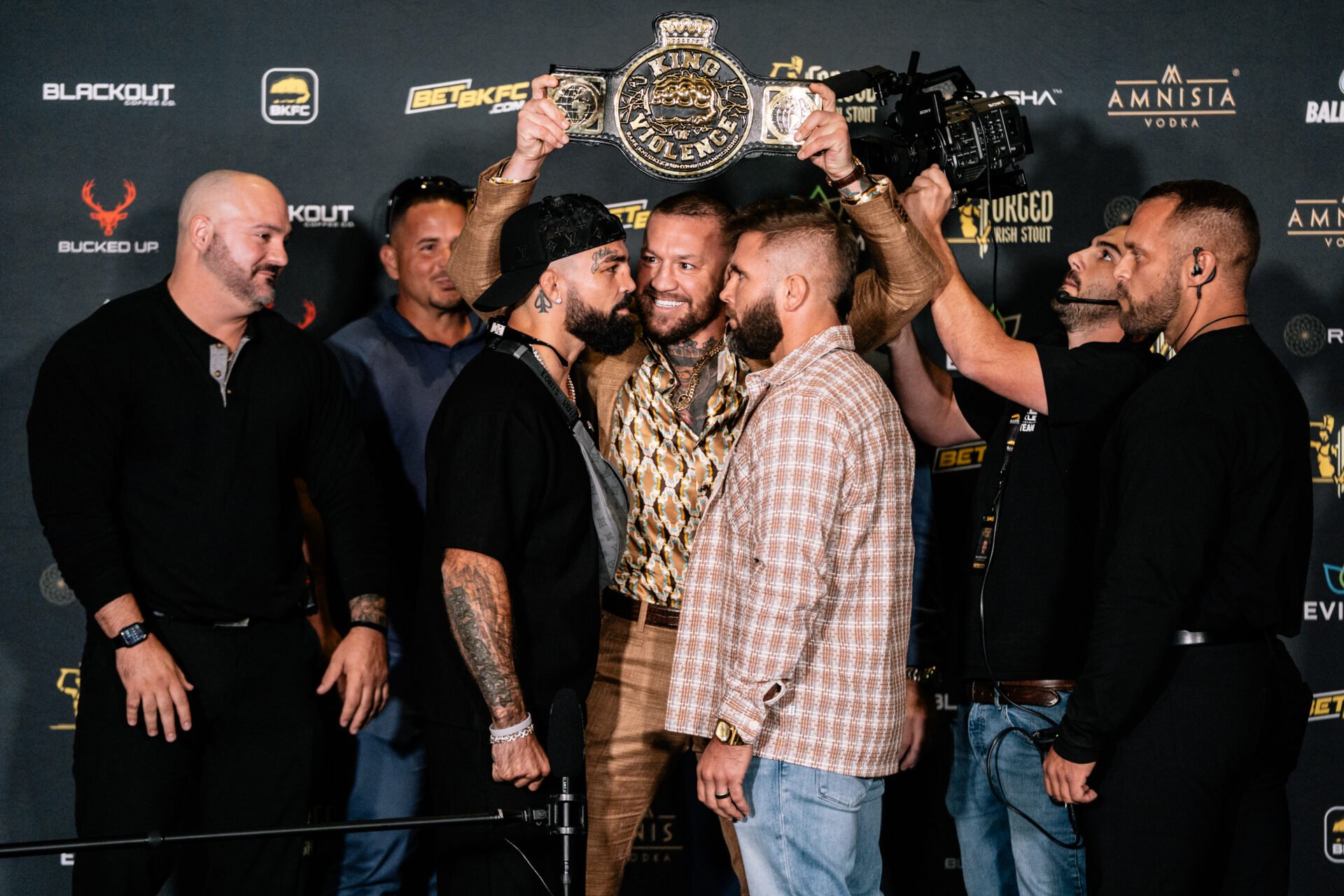 Conor McGregor in between Mike Perry and Jeremy Stephens face off at BKFC 82