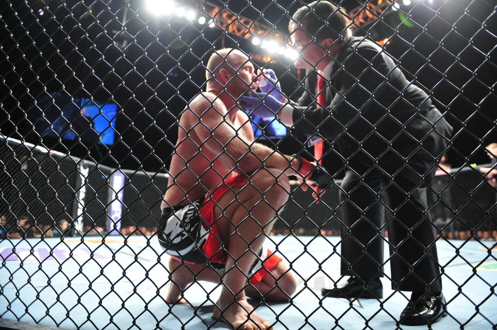 Ringside physician examines UFC fighter Tim Boetsch. Image has nothing to do with transgender competitors in combat sports.