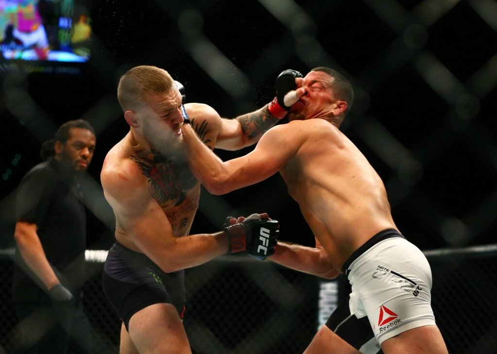 MMA: UFC 196-McGregor vs Diaz, March 5, 2016; Las Vegas, NV, USA; Conor McGregor (left) punches Nate Diaz in the face during UFC 196 at MGM Grand Garden Arena. Mandatory Credit: Mark J. Rebilas-USA TODAY Sports, 05.03.2016 21:54:12, 9172261, MGM Grand Garden Arena, Nate Diaz, Diaz, MMA, Conor McGregor PUBLICATIONxINxGERxSUIxAUTxONLY Copyright: xMarkxJ.xRebilasx 9172261