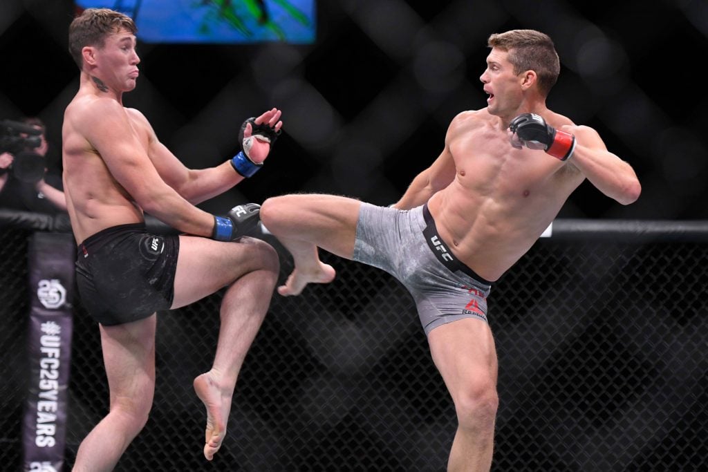 Stephen Thompson kicks Darren Till during their UFC Liverpool main event bout