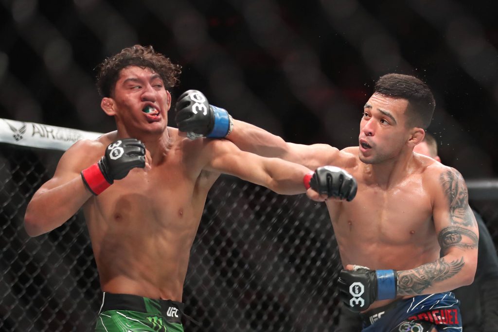 April 8, 2023, Miami, Florida,USA: CHRISTIAN RODRIGUEZ, right, punches RAUL ROSAS JR. in their bantamweight fight during the UFC 287 event at Kaseya Center in Miami. Rodriguez (9-1 MMA, 2-1 UFC) defeated Raul Rosas Jr. via unanimous decision (29-28, 29-28, 29-28). Miami USA - ZUMAp175 20230408_zsa_p175_171 Copyright: xAlejandroxSalazarx
