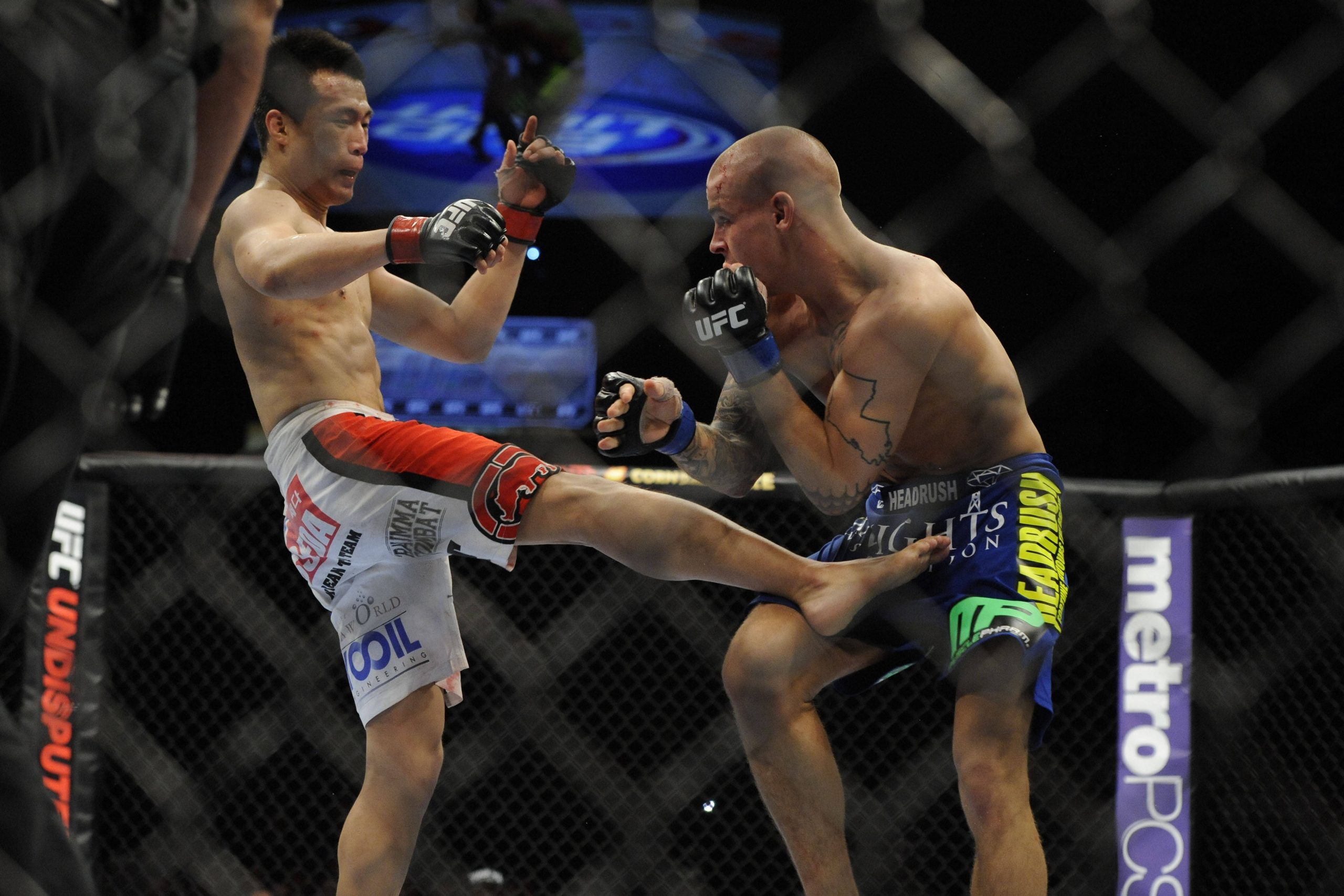 MMA: UFC on Fuel TV 3-Korean Zombie vs Poirier May 15, 2012; Fairfax, VA, USA; The Korean Zombie (left) gives a right leg to the midsection of Dustin Poirier (right) during the Korean zombie vs Poirier event at Patriot Center. Fairfax Patriot Center Virginia UNITED STATES, EDITORIAL USE ONLY PUBLICATIONxINxGERxSUIxAUTxONLY Copyright: xRafaelxSuanes-USAxTODAYxSportsx 6255680