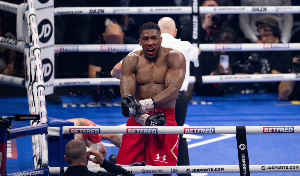 Anthony Joshua ( red shorts) knocks out Robert Helenius ( white blue shorts) during their International Heavyweight contest at the O2, London, England on the 12 August 2023. PMI-5697-0011
