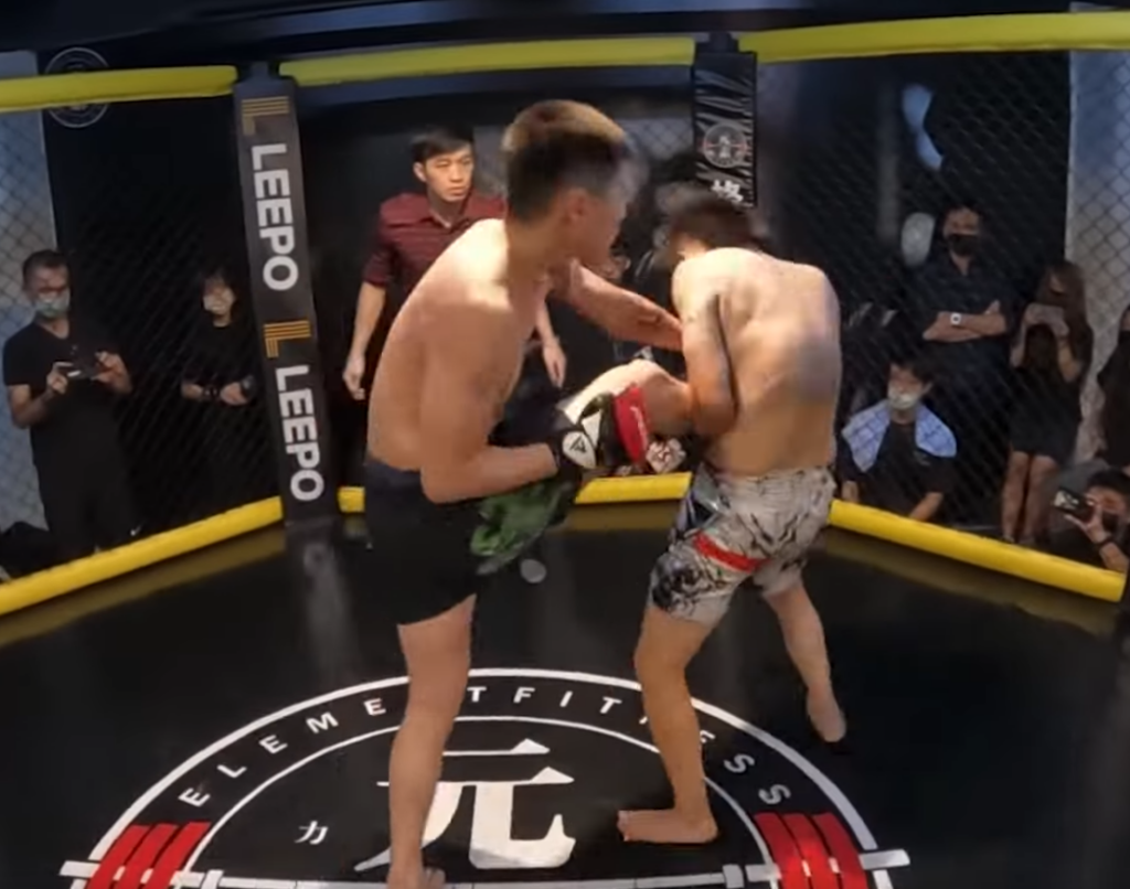 TKD fighter lands punch when MMA fighter catches his kick