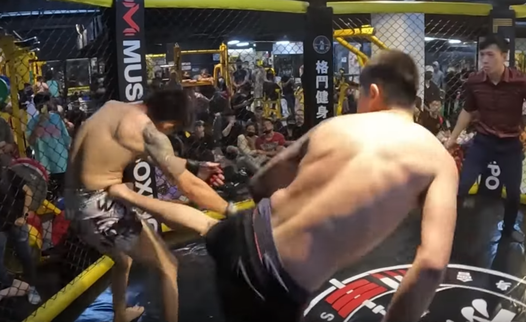 The spinning kick lands