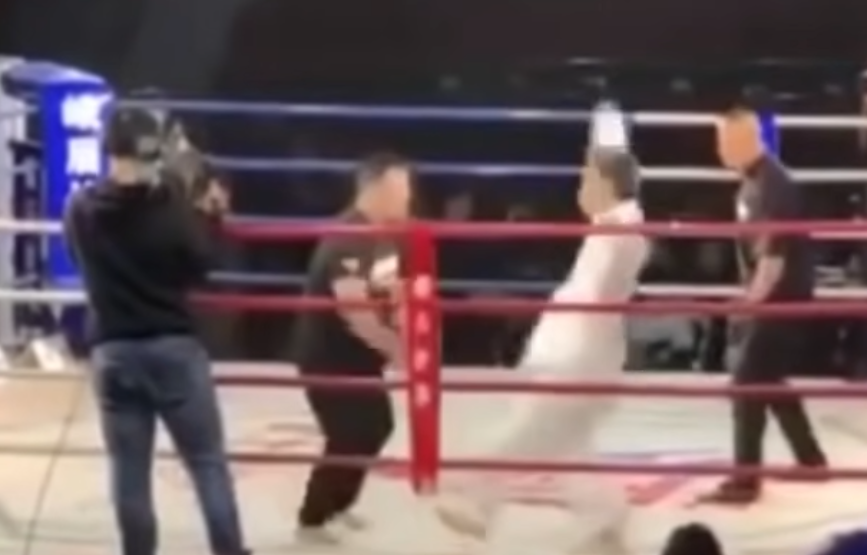 Tai Chi master faces Iron Palm master in a ring and gets shoved back with force, arms flailing
