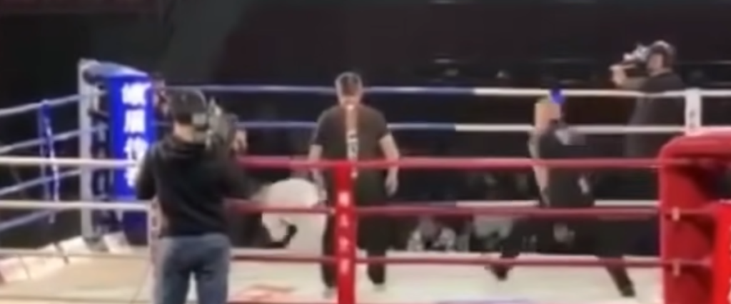 Tai Chi master faces Iron Palm master in a ring, falls to the ground