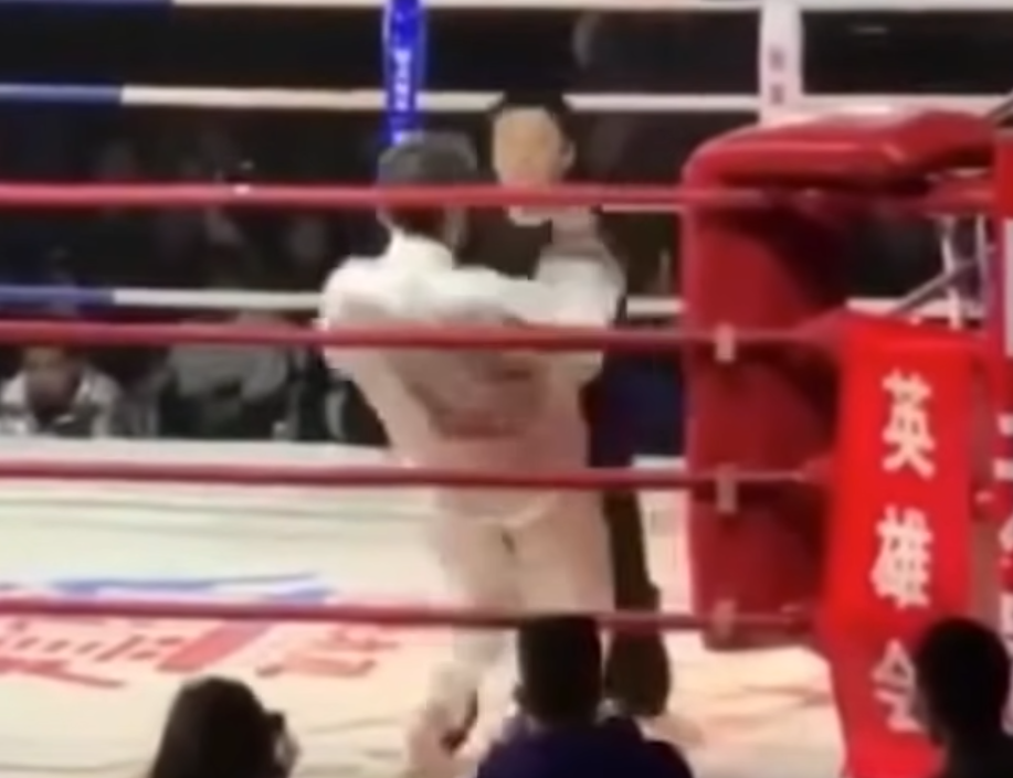 Tai Chi master faces Iron Palm master in a ring in a shoving match