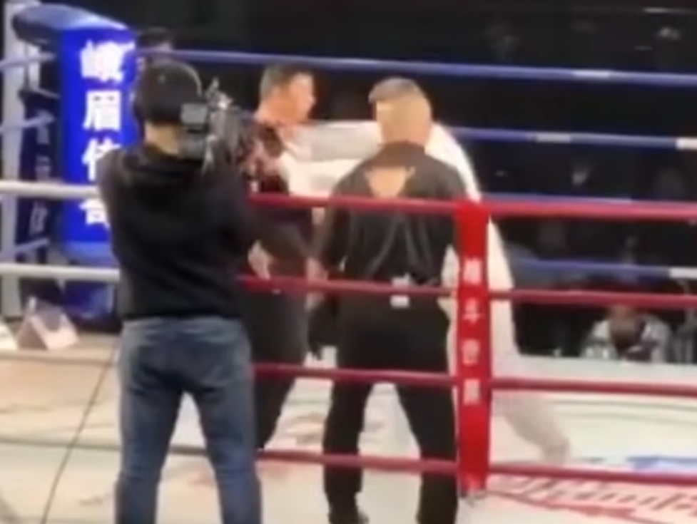 Tai Chi master faces Iron Palm master in a ring in a shoving match