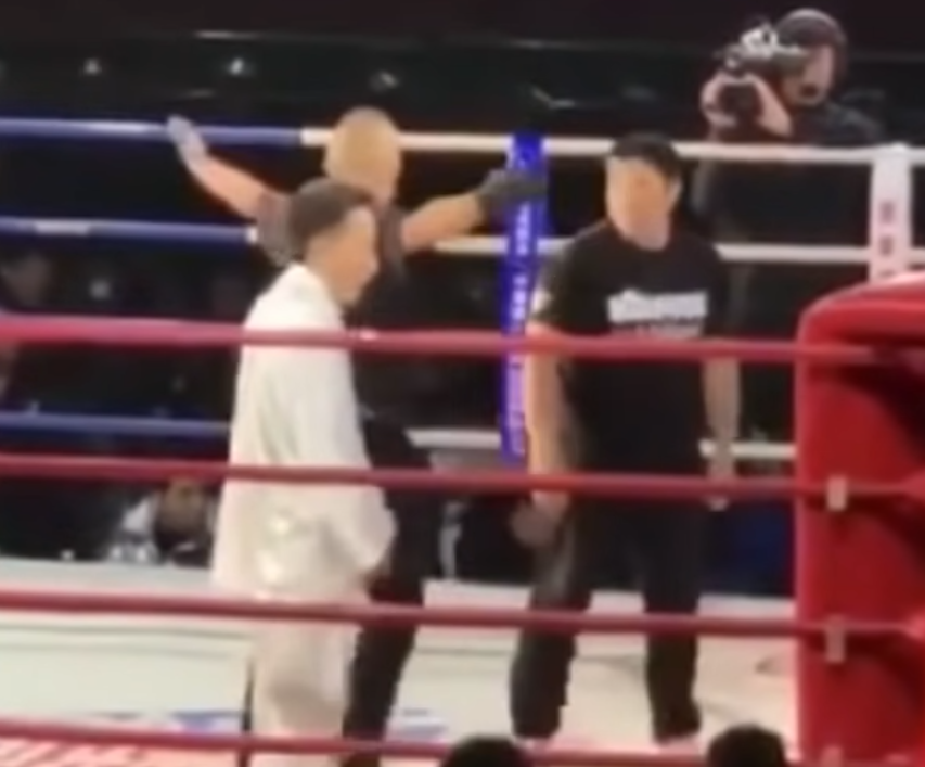 Tai Chi master faces Iron Palm master in a ring in a shoving match