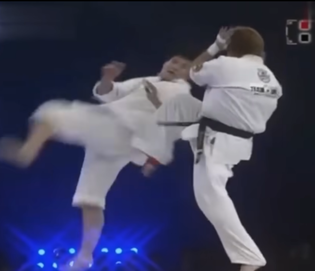 Tai Chi practitioner sets up a corkscrew kick