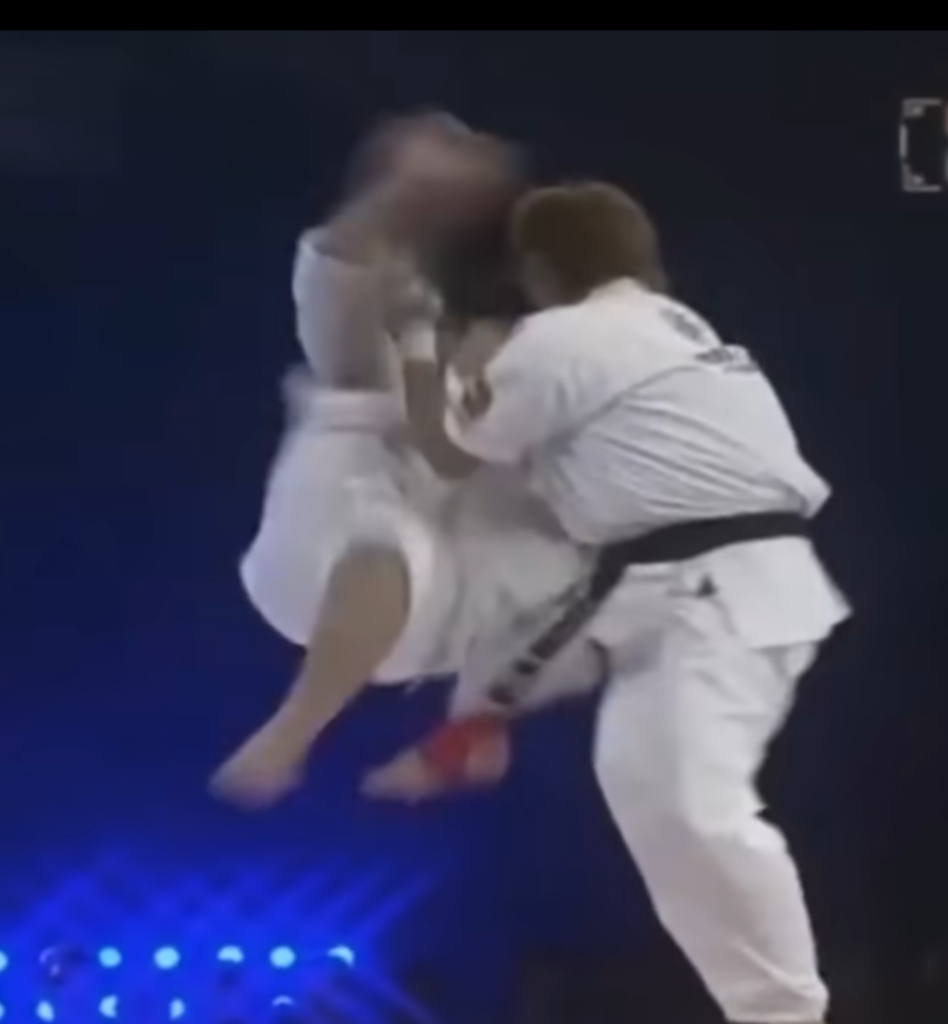 Tai Chi practitioner sets up a corkscrew kick